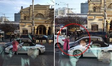  - gestko_v_kieve_devushka_toporom_krushila_elitniy_sportkar_(video)_5bec56a0e3140.jpg